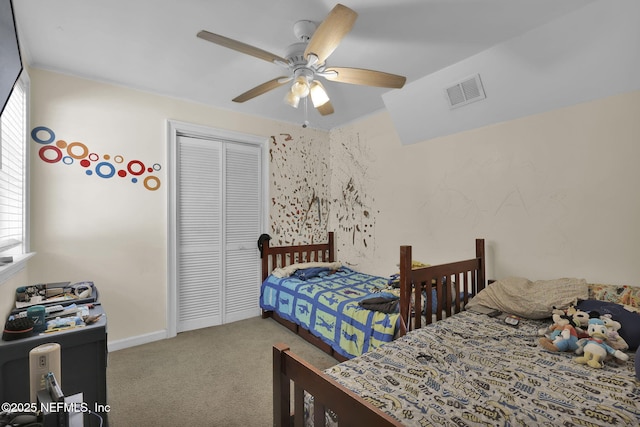 carpeted bedroom featuring baseboards, visible vents, ceiling fan, and a closet