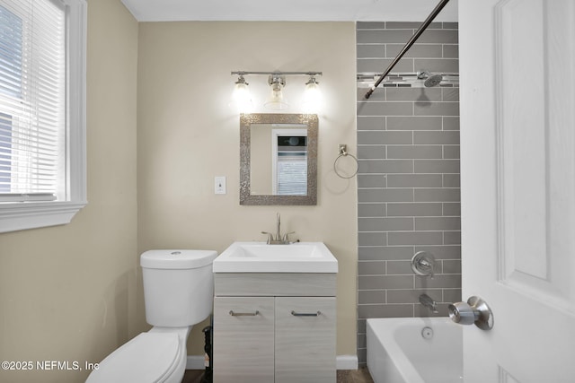 bathroom with toilet, vanity, and shower / bathing tub combination