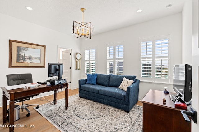 office area featuring light hardwood / wood-style flooring and a notable chandelier