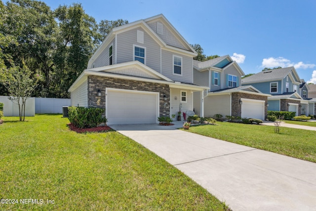 view of front of home with a garage and a front lawn