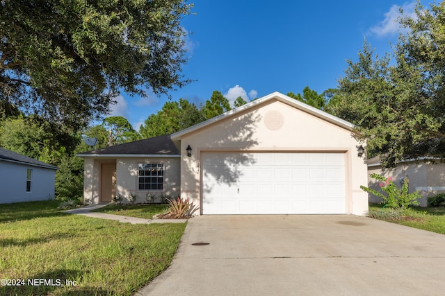 single story home with a front lawn and a garage