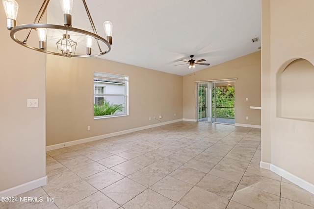 unfurnished room featuring visible vents, vaulted ceiling, baseboards, and ceiling fan with notable chandelier