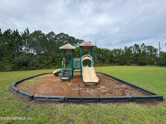 view of playground featuring a lawn