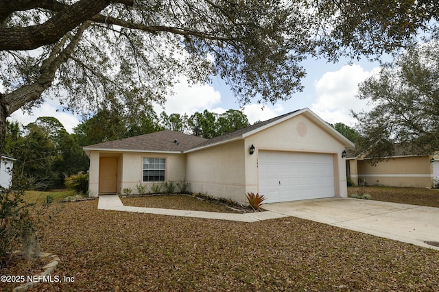 ranch-style home with driveway, an attached garage, roof with shingles, and stucco siding