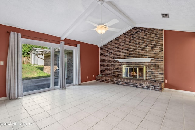 unfurnished living room with a fireplace, light tile patterned floors, a textured ceiling, ceiling fan, and vaulted ceiling with beams