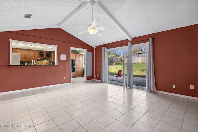 unfurnished living room featuring light tile patterned floors, vaulted ceiling with beams, a textured ceiling, and ceiling fan