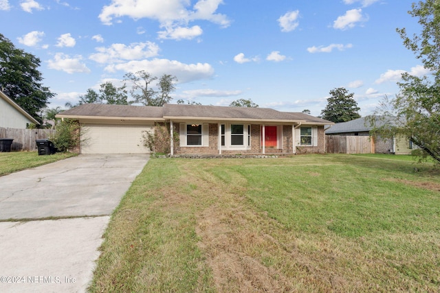 single story home featuring a front yard and a garage