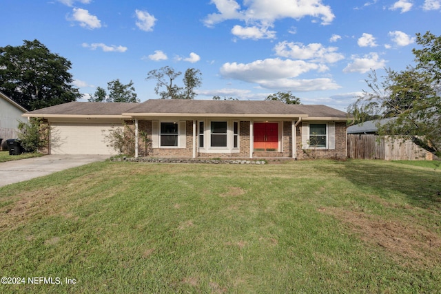 single story home with a porch, a garage, and a front yard