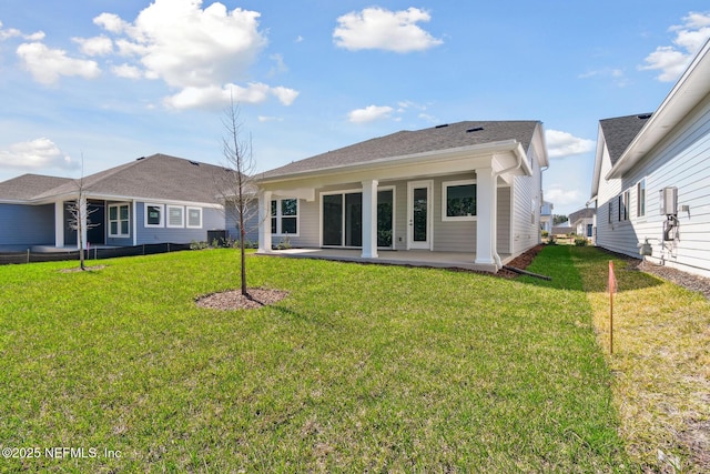211 Rushing Dr, Saint Augustine, FL 32092 - back of house featuring a lawn and a patio