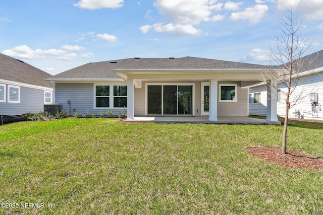 211 Rushing Dr, Saint Augustine, FL 32092 - back of property with a patio area and a lawn