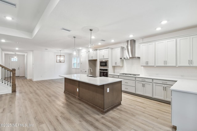 211 Rushing Dr, Saint Augustine, FL 32092 - kitchen with wall chimney range hood, built in microwave, light countertops, recessed lighting, and light wood-style floors
