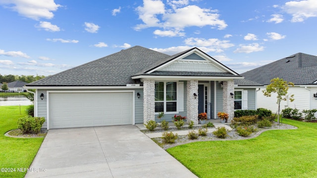 view of front of home featuring a garage and a front lawn