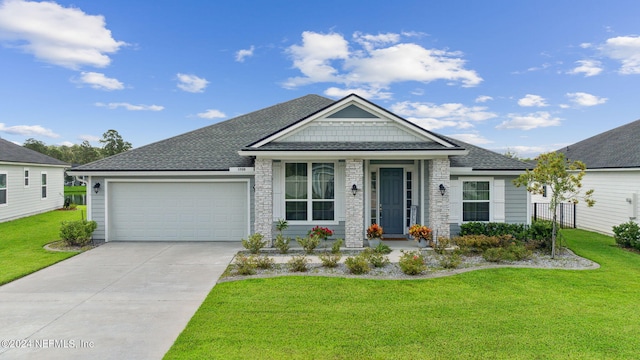 view of front of home with a garage and a front lawn