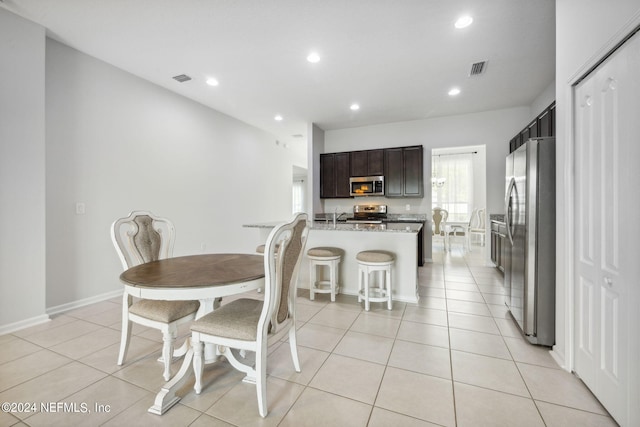 dining area featuring light tile patterned floors