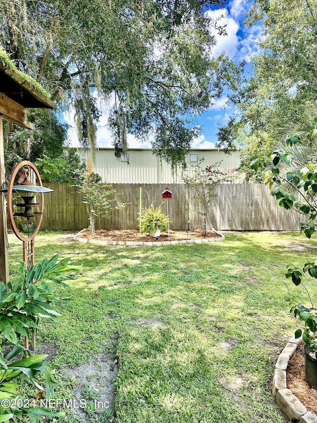 view of yard featuring a fenced backyard