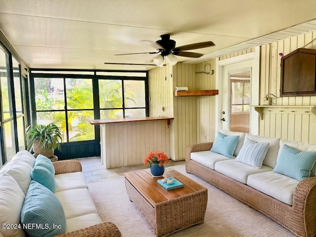 sunroom featuring a ceiling fan