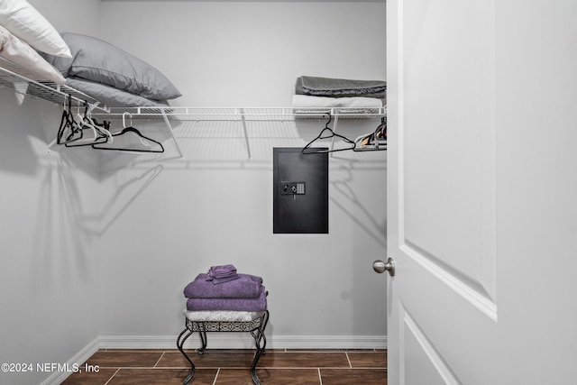 walk in closet featuring wood finish floors