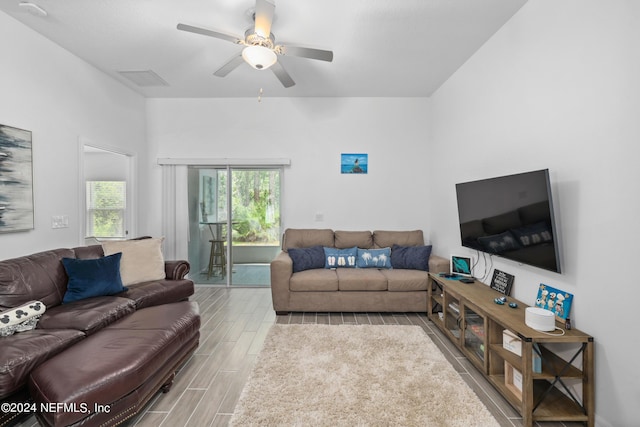 living area featuring ceiling fan and wood finish floors