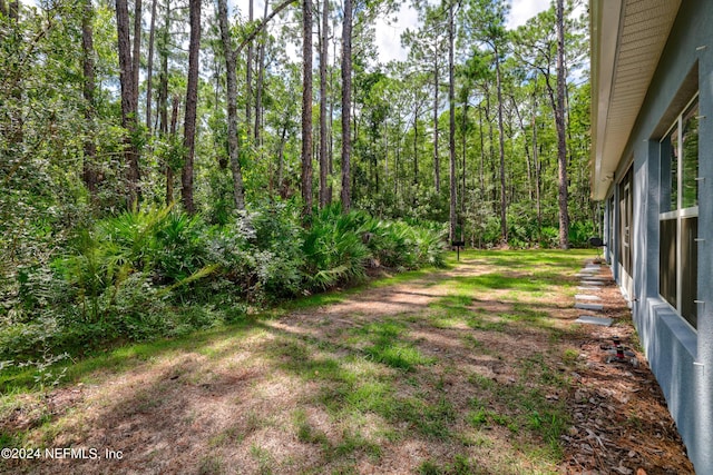 view of yard with a forest view