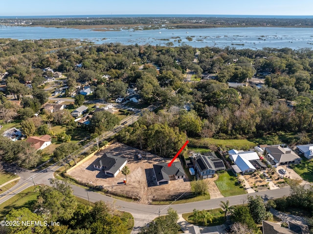 birds eye view of property featuring a water view