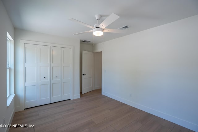 411 Royal Rd, Saint Augustine South, FL 32086 - unfurnished bedroom featuring wood finished floors, a closet, and a ceiling fan
