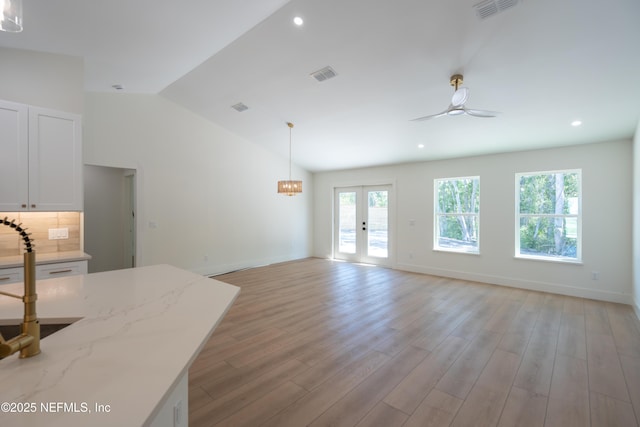 411 Royal Rd, Saint Augustine South, FL 32086 - living area featuring light wood-type flooring, vaulted ceiling, ceiling fan, recessed lighting, and french doors