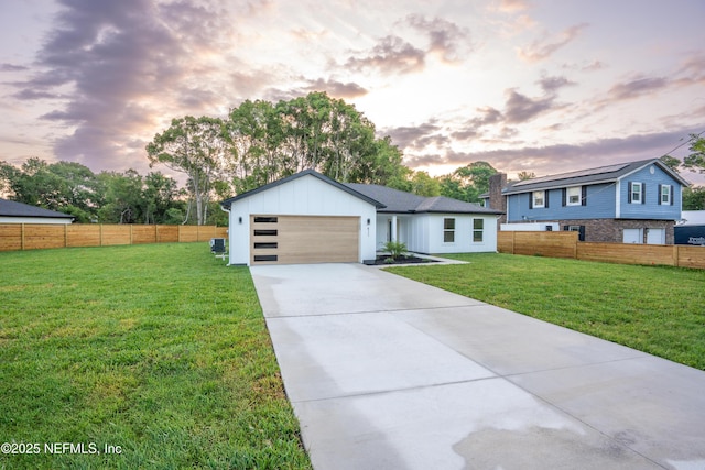 411 Royal Rd, Saint Augustine South, FL 32086 - view of front of house featuring concrete driveway, an attached garage, and board and batten siding