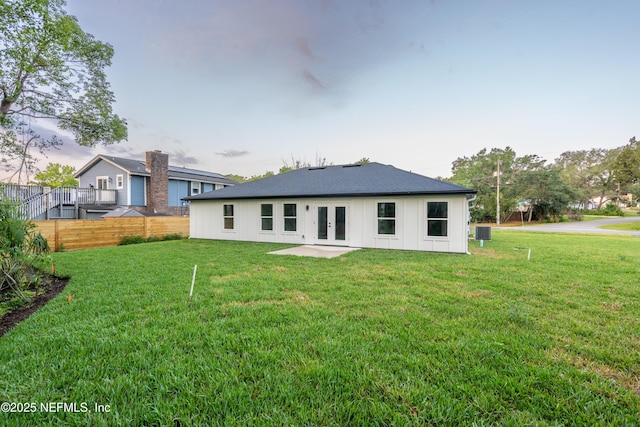 411 Royal Rd, Saint Augustine South, FL 32086 - rear view of house with french doors and board and batten siding
