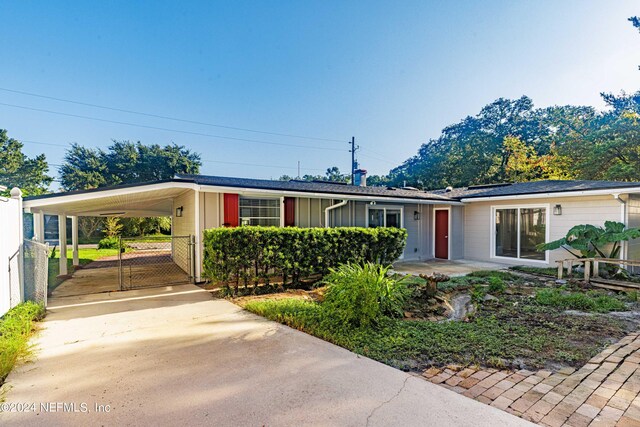 view of front of property with a carport