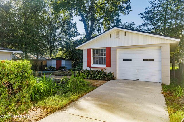 view of front of house with an outbuilding and a garage