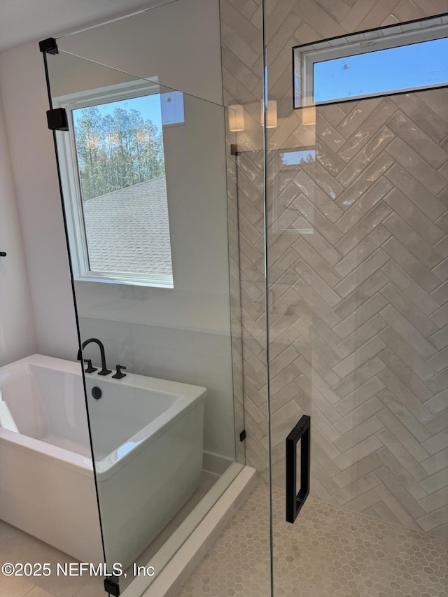 bathroom featuring plus walk in shower