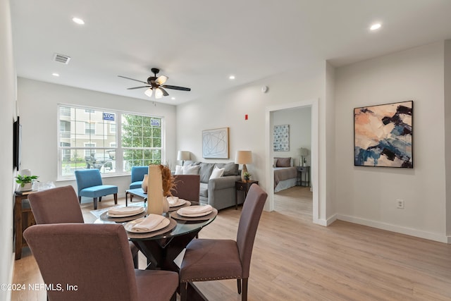 dining space featuring ceiling fan and light hardwood / wood-style floors