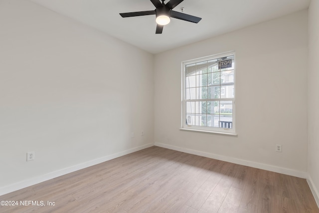 unfurnished room featuring ceiling fan and light hardwood / wood-style floors