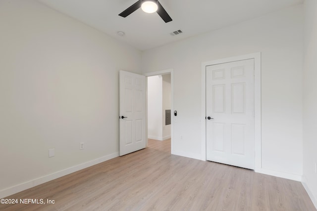 unfurnished bedroom with light hardwood / wood-style flooring and ceiling fan