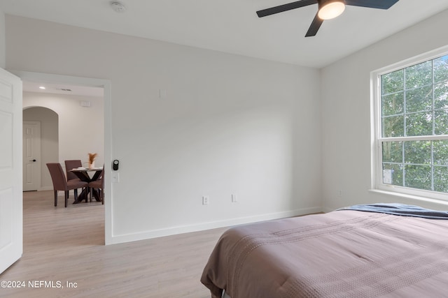 bedroom with light wood-type flooring and ceiling fan