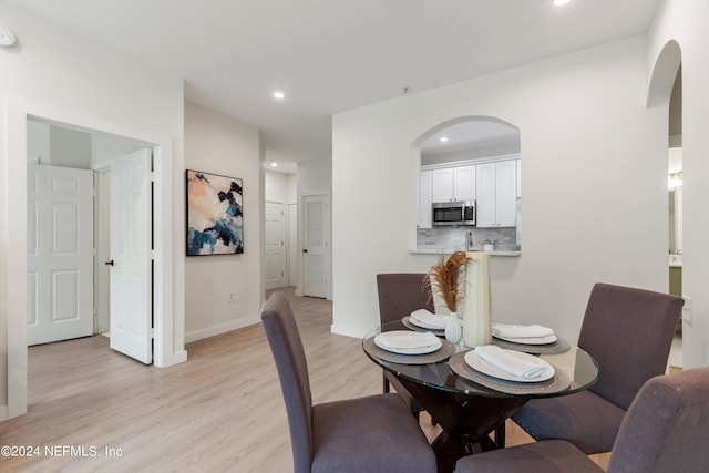 dining room with light hardwood / wood-style floors