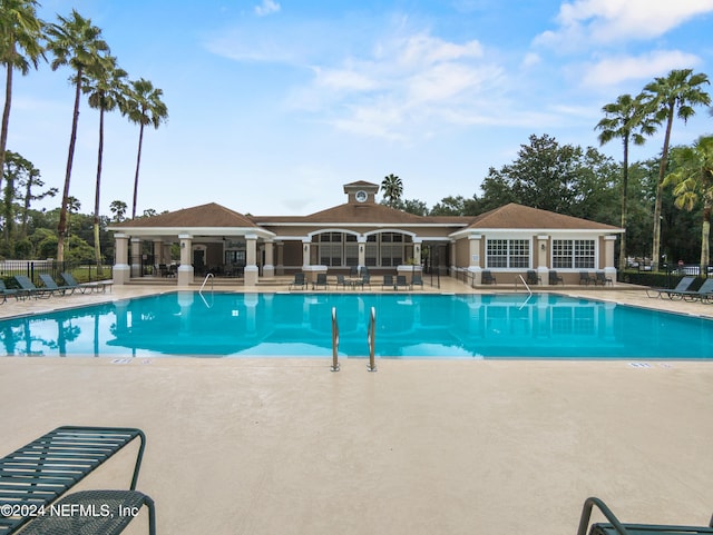 view of swimming pool featuring a patio and a gazebo