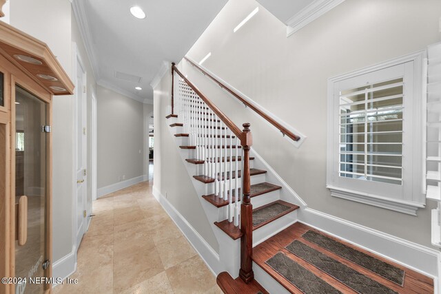 staircase with crown molding