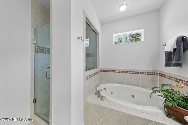 bathroom featuring plus walk in shower