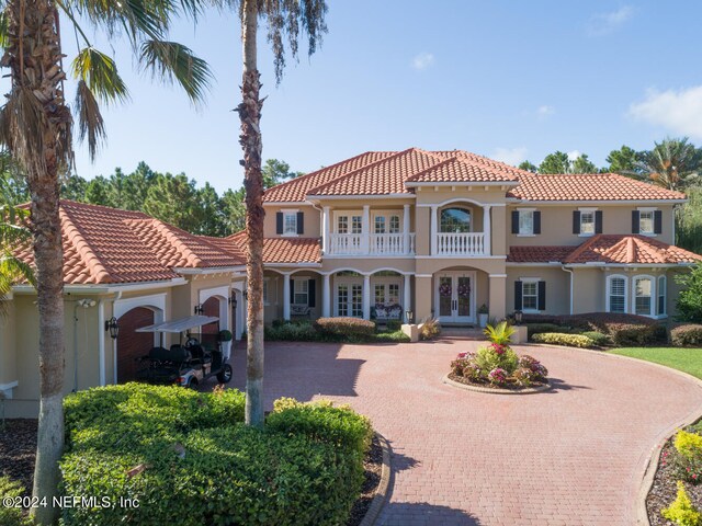 mediterranean / spanish-style house featuring a balcony