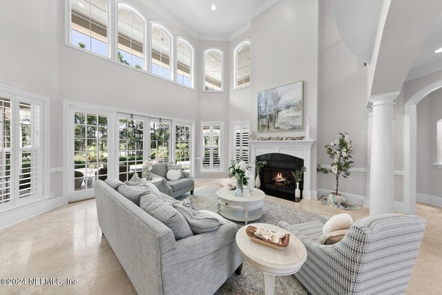 living room featuring ornamental molding and a healthy amount of sunlight