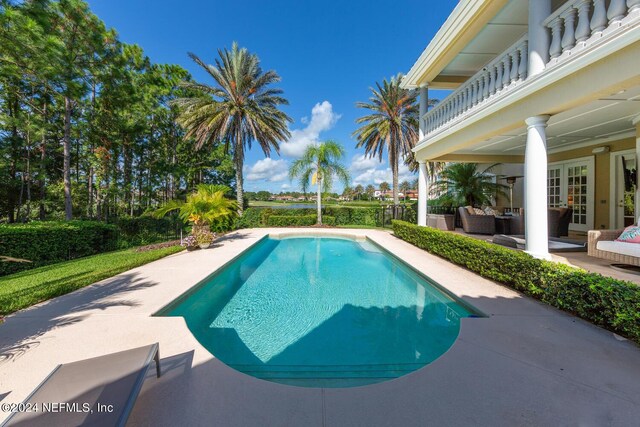 view of pool with outdoor lounge area and a patio area