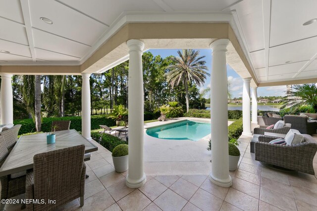 view of swimming pool with a patio area