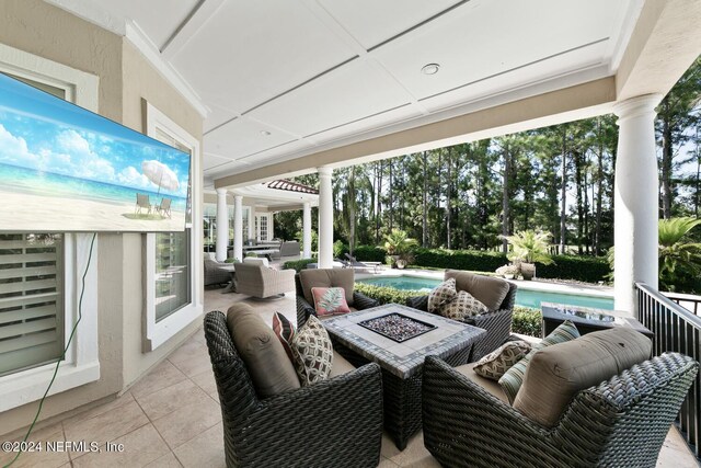 exterior space with an outdoor living space with a fire pit