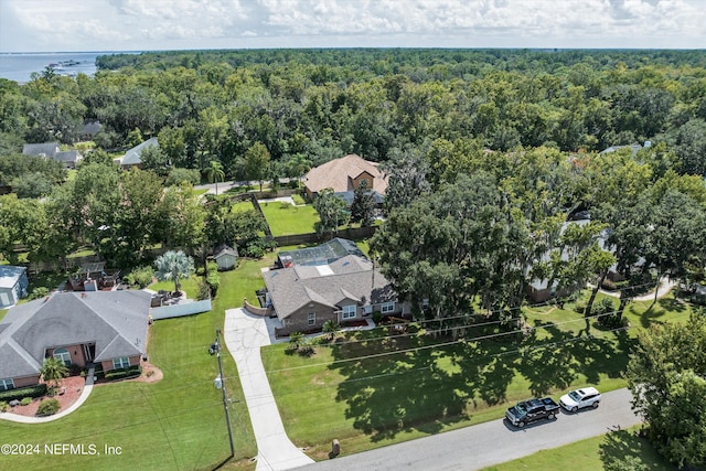 aerial view featuring a water view and a forest view