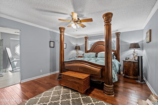 bedroom featuring decorative columns, wood-type flooring, ornamental molding, a textured ceiling, and baseboards