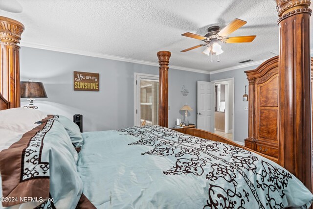 bedroom featuring ceiling fan, a textured ceiling, and ornamental molding