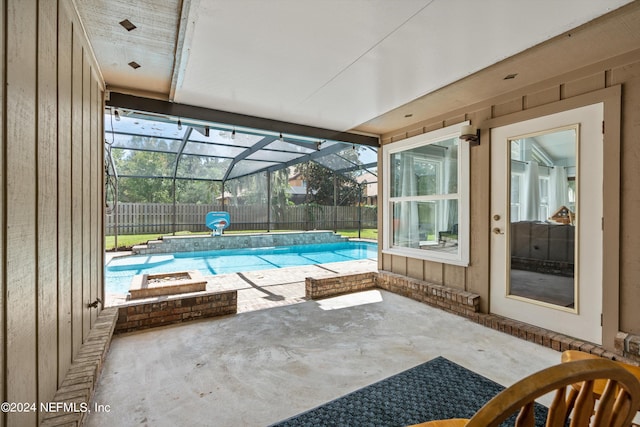 view of pool featuring a lanai and a patio