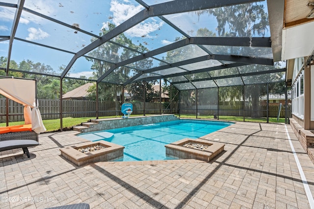 view of swimming pool with an outdoor fire pit, a fenced backyard, a lanai, a fenced in pool, and a patio area