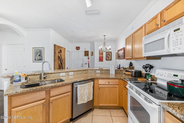 kitchen featuring ornamental molding, white appliances, a chandelier, light tile patterned floors, and sink